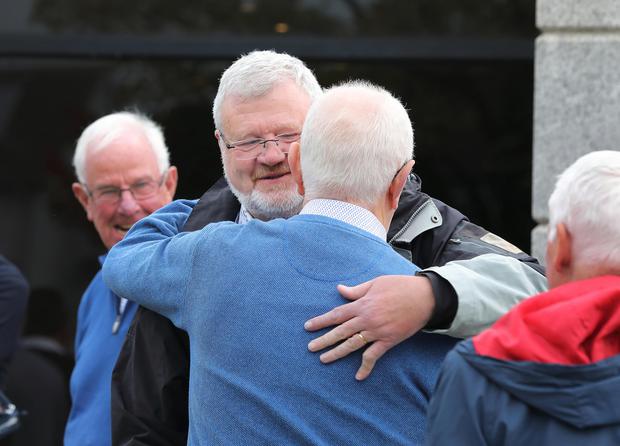 Former Kerry footballer Eoin 'Bomber' Liston hugs Dublin goalkeeper Paddy Cullen after paying tribute to the late Brian Mullins.  Photo: Frank McGrath
