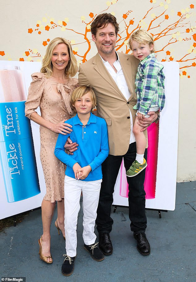“James Tupper is Atlas' father and only living relative.  James loves both Homer and Atlas because a father wants the best for both of them,' the filing states.  The blended family of four is pictured in 2012