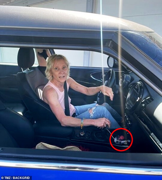 A photo before the August 5 accident shows Heche driving with a bottle of alcohol in the cup holder