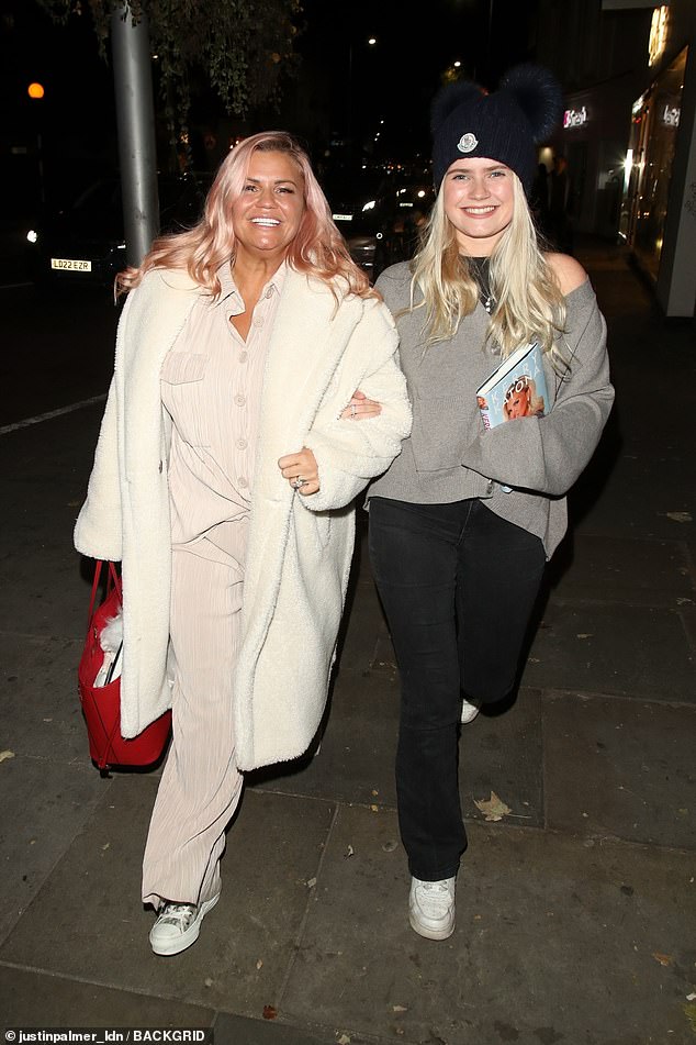 Mother and daughter: Kerry went out with her daughter Lilly-Sue on Sunday evening, Lilly holding Kerry's new book