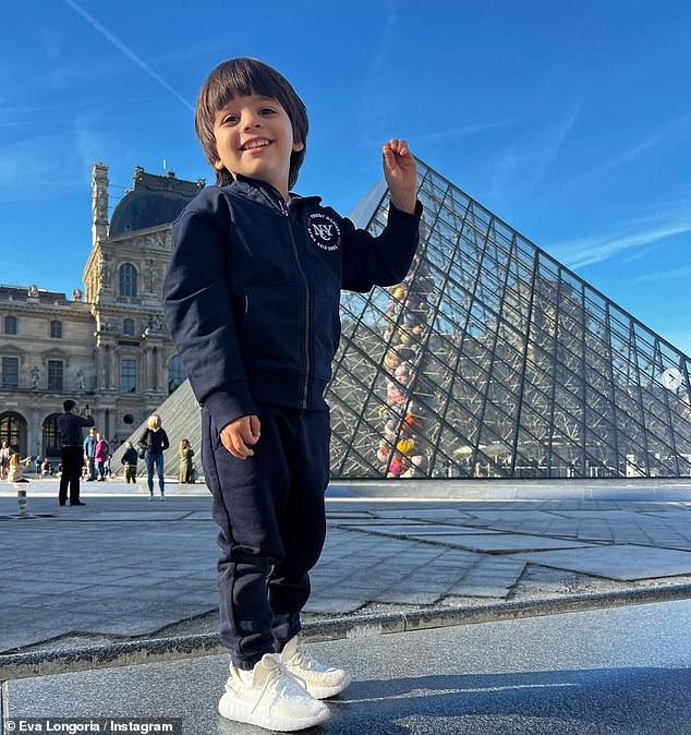 Cool kid: The four-year-old looked effortlessly cool in his navy tracksuit and his mum added a pair of white Yeezy trainers to complete the stylish toddler look