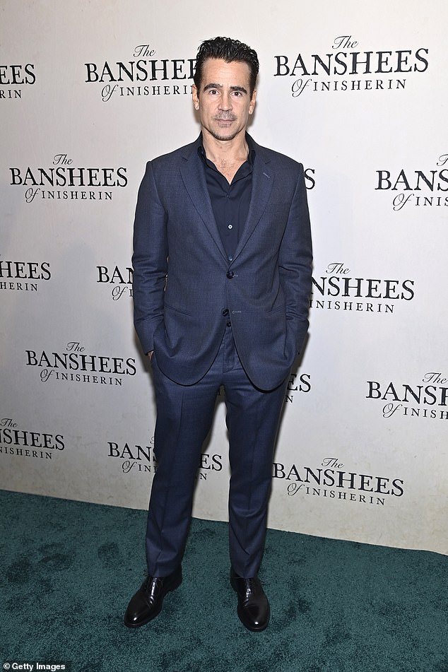 Colin look: Farrell hit the red carpet in a black shirt under a dark blue-gray suit coat for his red carpet look