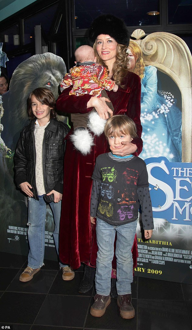 After the sudden death of her husband Martin, Natascha had to raise their three boys Theo (left) Otis (right) and Rex (carried by her mother) (Pictured at the premiere of The Secret of Moonacre in 2009)